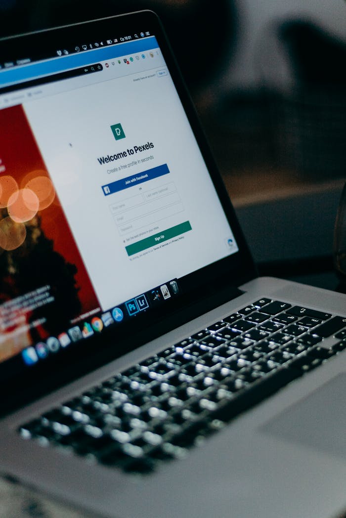 brand-01 Close-up of a laptop showing the Pexels login interface with a blurred background, creating a moody tech scene.